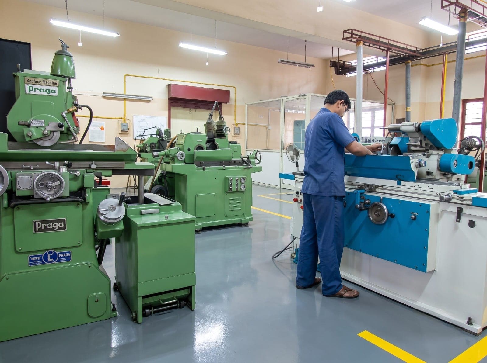 Operator at a cylindrical grinder in the grinding shop
