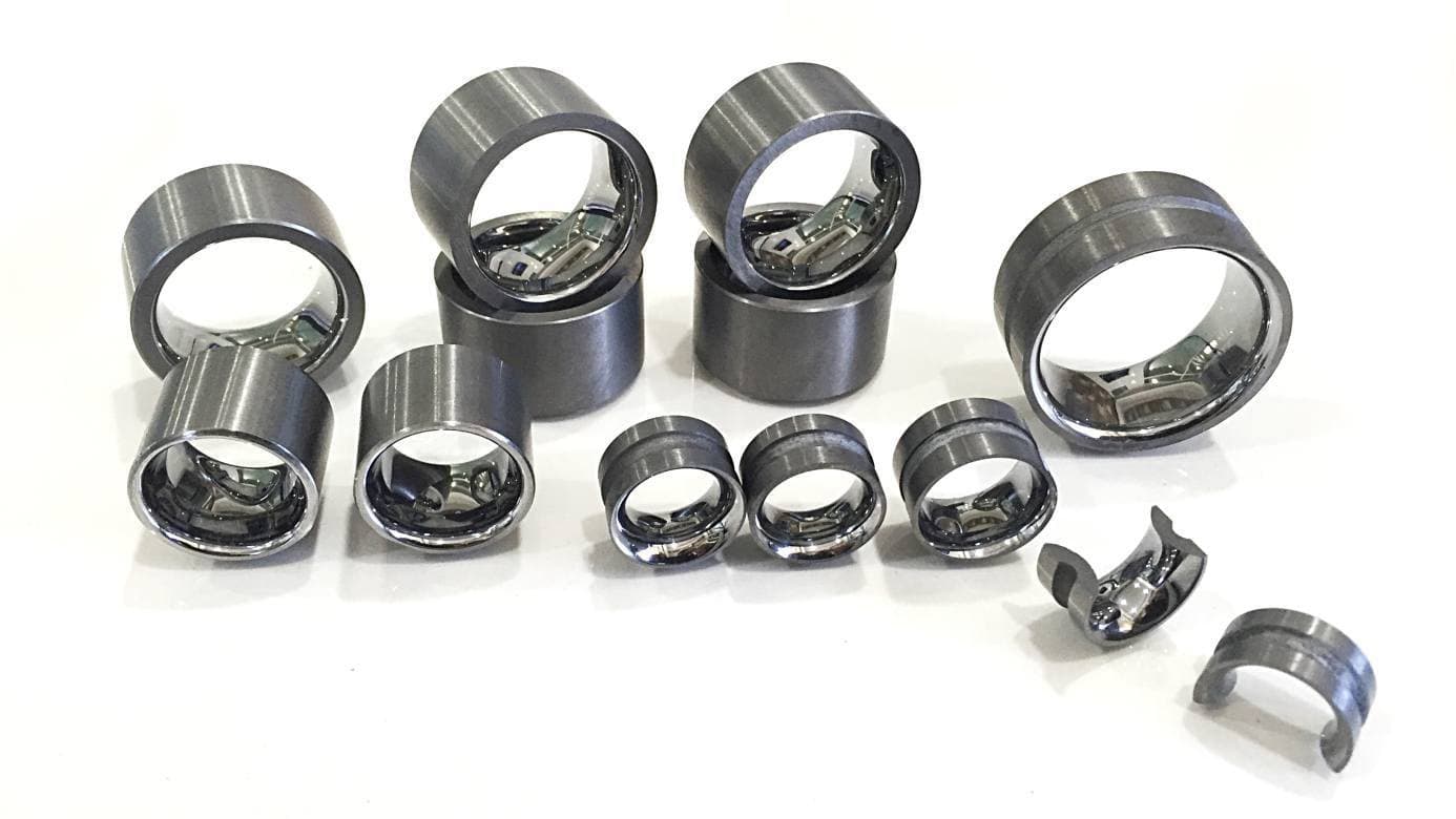 Tungsten carbide seal rings and wire guides with lapped bores